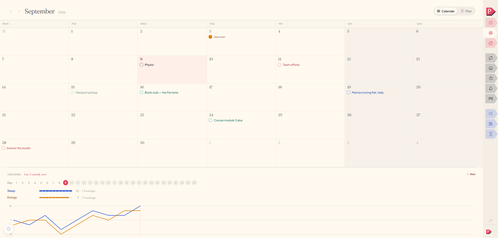 The month calendar grid at a desk, with a few days holding tasks and one showing a journal glyph
